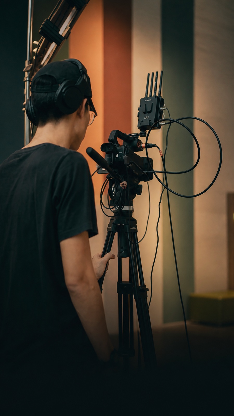 An unidentified camera operator beside a professional camera rig